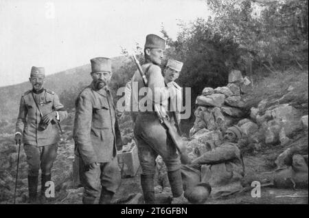 'Alexandre de Serbie au front de Monastir; Le prince a rencontre un blesse serbe qui attendait des secours, couche sur la bord de la route, et il va l'emmener dans son automobile', 1916. From &quot;L'Album de la Guerre 1914-1919, Volume 1&quot; [L'Illustration, Paris, 1924]. Stock Photo