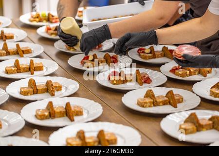 Scene encapsulates the art of culinary presentation in a professional kitchen setting. Stock Photo