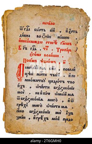 Dilapidated yellowed pages of an old church Old Church Slavonic book. Isolated on white Stock Photo