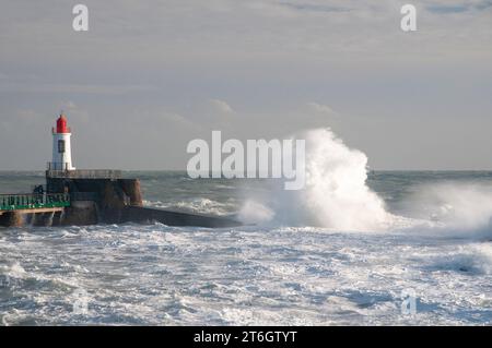 The red lighthouse and breakwater during ‘Ciaran’ storm in October 2023, La Chaume district, Les Sables d’Olonne, Vendee (85), Pays de la Loire region Stock Photo