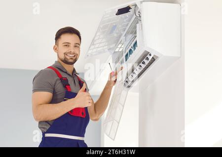 Worker from air conditioning installation service provides good service and gives thumbs up Stock Photo