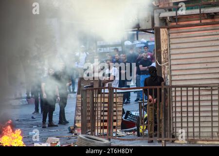 Jenin, Palestine. 9th Nov, 2023. A Masked Palestinian Gunman Runs Amid ...