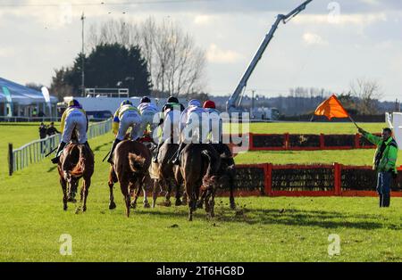 Down Royal Racecourse, Lisburn, Northern Ireland. 10th Nov 2023. The Ladbrokes Festival of Racing (Day 1) got underway today after last week's weather-related postponement.The feature race of the day was the BOTTLEGREEN HURDLE (GRADE 3) (4yo+) with €29,500 for the winner. The race was won by Irish Point (1) (half-white half-pink tunic) ridden by Jack Kennedy and trained by Gordon Elliott. The start was slightly delayed with the removal of a jump on health and safety grounds given the low position of the sun over the course. Credit: CAZIMB/Alamy Live News. Stock Photo