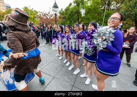 NYU Cheerleaders in Washington Square Park in Greenwich Village in New York on Tuesday, October 31, 2023 prior to marching in the 33rd Annual Children's Halloween Parade. The family friendly parade gathers in the park at the arch and marches around the park ending in a celebration at New York University. (© Richard B. Levine) Stock Photo