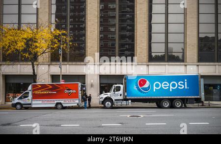 Pepsi and Doritos delivery trucks, both Pepsico products, parked in Chelsea in New York on Monday, October 30 2023. (© Richard B. Levine) Stock Photo