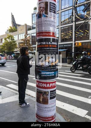 Kidnapped flyers are seen posted with a Pro-Palestine posters in the Chelsea neighborhood of New York on Sunday, November 5, 2023. (© Richard B. Levine) Stock Photo