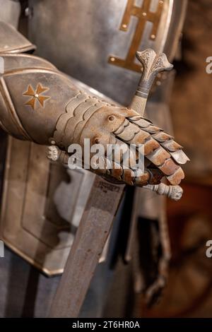 Armored glove of a medieval knight armor Stock Photo