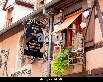 The nose sign, also cantilever or guild sign is a traditional form of advertising in Kaysersberg in Alsace Stock Photo