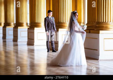 Saint Petersburg, Russia - August 03, 2023: wedding photo shoot in the interiors of the Winter Palace in St. Petersburg Stock Photo