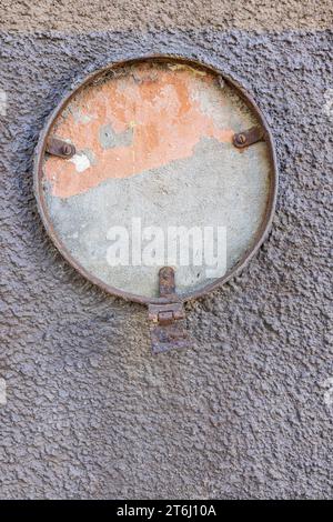 Remains of facade lighting on an old wall in Latvia Stock Photo