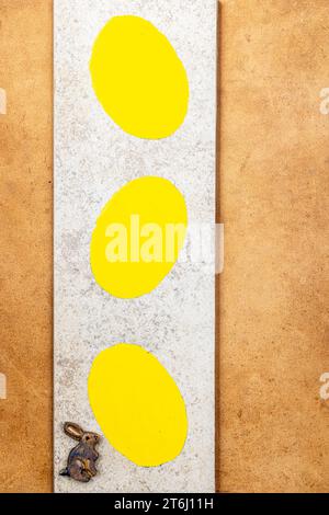 Colorful Easter decoration with a bunny and three painted eggs Stock Photo
