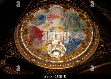 Interior view, crystal chandelier and ceiling painting Apollo with the Lyre by Marc Chagall in the dome, plafond, auditorium, Salle de Spectacle, Opera, Opera Palais Garnier, Paris, France Stock Photo