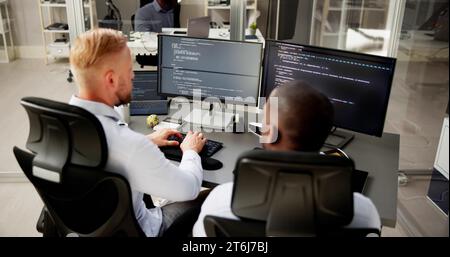 African American Programmer Man Coding On Computer Stock Photo