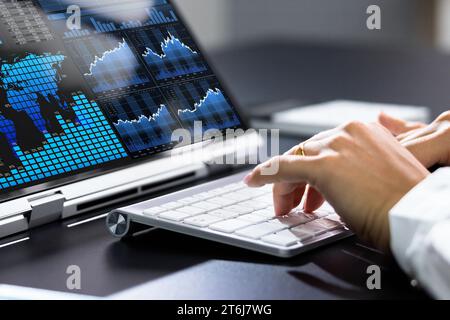 Female Analyst Analyzing KPIs on Laptop, Using Analytics and Data Stock Photo