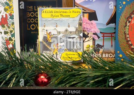 Dylan Thomas bookcover 'A Child's Christmas in Wales' book in Waterstones bookstore shop window display Carmarthenshire Wales UK November KATHY DEWITT Stock Photo
