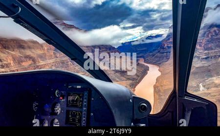 Helicopter flying over the Grand Canyon and the Colorado River, in the western area of this North American wonder, border of Arizona and Nevada of the Stock Photo