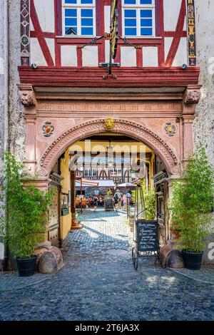 City of Bacharach on the Middle Rhine, passage to the Posthof Bacharach in Oberstrasse, historic garden pub, Stock Photo