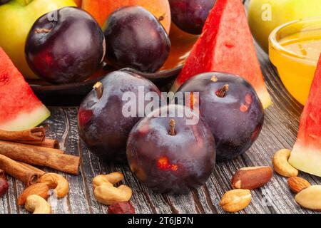 red plum on wood background Stock Photo