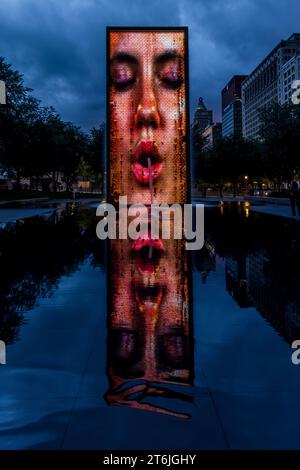 The Crown Fountain is a public sculpture with 2 50-ft. LED towers & a reflecting pool, by Catalan artist Jaume Plensa in Chicago, United States Stock Photo