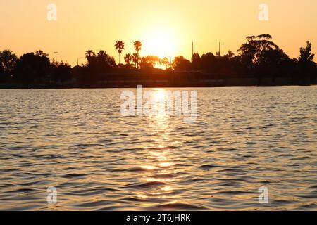 Sun setting over the lake Stock Photo