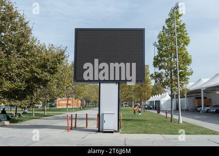 ISTANBUL, TURKEY - NOVEMBER 5, 2023: E-Digital big large empty blank screen big Billboard TV mockup template for advertisement. Stock Photo