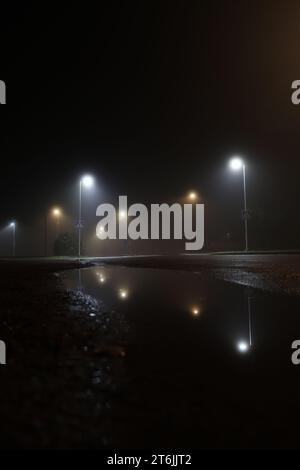 Empty night street with fog and lights Stock Photo