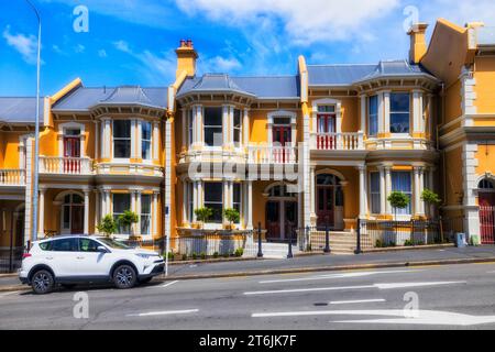 Facade of historic multi apartment building complex in downtown of Dunedin city of New Zealand. Stock Photo