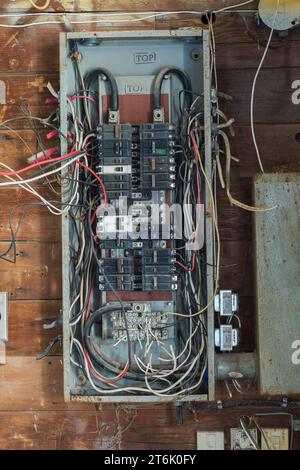 Old electricity distribution panel in abandoned commercial building. Stock Photo