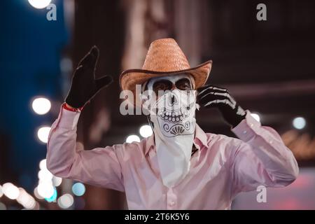 MEXICO CITY, MEXICO - NOVEMBER 04, 2023: Day of the dead parade 2023 in Mexico City, Typical costumes of the region of Mexico, representing death, tra Stock Photo