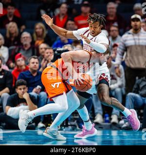 November 10, 2023: Virginia Tech Hokies guard Hunter Cattoor (0) is guarded by South Carolina Gamecocks guard Meechie Johnson (5) during the first half of the ''He Gets Us'' Hall of Fame Series 2023 matchup at Spectrum Center in Charlotte, NC. (Scott Kinser/CSM) Stock Photo