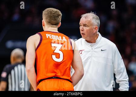 November 10, 2023: Virginia Tech Hokies guard Sean Pedulla (3) talks with head coach Mike Young during the first half of the ''He Gets Us'' Hall of Fame Series 2023 matchup against the South Carolina Gamecocks at Spectrum Center in Charlotte, NC. (Scott Kinser/CSM) Stock Photo