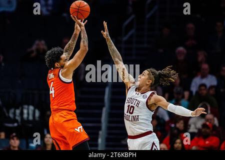 November 10, 2023: Virginia Tech Hokies forward Mekhi Long (4) shoots over South Carolina Gamecocks guard Myles Stute (10) during the first half of the ''He Gets Us'' Hall of Fame Series 2023 matchup at Spectrum Center in Charlotte, NC. (Scott Kinser/CSM) Stock Photo