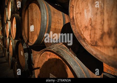 Wine Casks in the Cellar of a Winery in Napa Valley, California Stock Photo