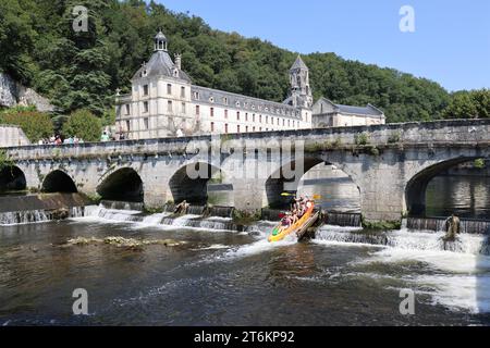 Brantôme in Périgord also called the Venice of Périgord because of the Dronne river which crosses it on all sides. Abbey embedded in the cliff, troglo Stock Photo