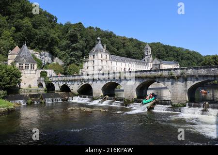 Brantôme in Périgord also called the Venice of Périgord because of the Dronne river which crosses it on all sides. Abbey embedded in the cliff, troglo Stock Photo