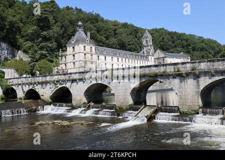 Brantôme in Périgord also called the Venice of Périgord because of the Dronne river which crosses it on all sides. Abbey embedded in the cliff, troglo Stock Photo