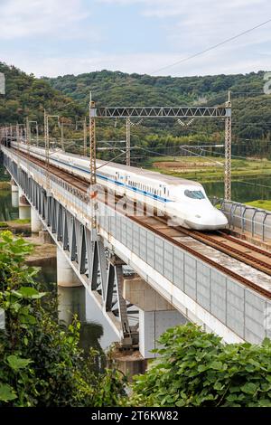 Kurashiki, Japan - October 1, 2023: Shinkansen N700 high-speed train operated by Japan Rail JR on Sanyo Shinkansen line in Kurashiki, Japan. Stock Photo