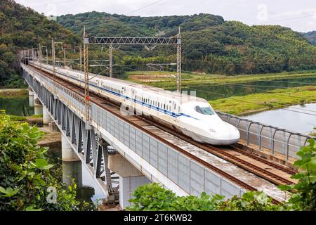Kurashiki, Japan - October 1, 2023: Shinkansen N700 high-speed train operated by Japan Rail JR on Sanyo Shinkansen line in Kurashiki, Japan. Stock Photo