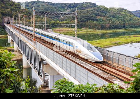 Kurashiki, Japan - October 1, 2023: Shinkansen 500 high-speed train operated by Japan Rail JR West on Sanyo Shinkansen line in Kurashiki, Japan. Stock Photo