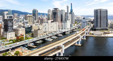 Kobe skyline from above with port and elevated road bridge panorama in Japan Stock Photo