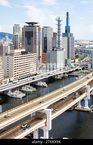 Kobe skyline from above with port and elevated road bridge portrait format in Japan Stock Photo