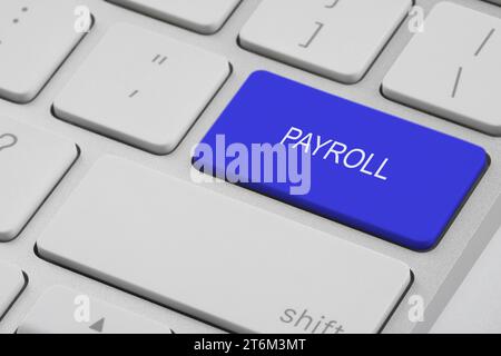 Blue button with word Payroll on keyboard, closeup Stock Photo