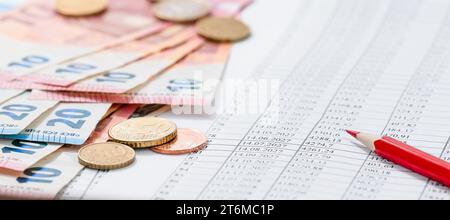 Payroll with finance business accounting stock, euro cash, and a red pencil. Stock Photo