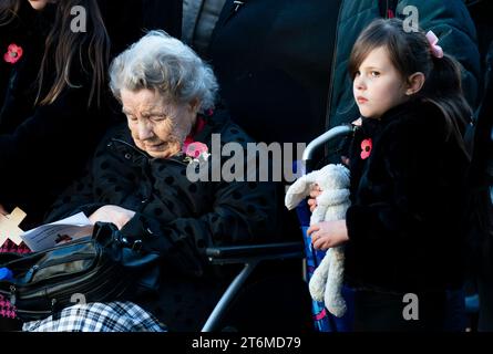 Edinburgh, Scotland, UK. 11th November, 2023.  Old and young pay respect at the Remembrance Day ceremony at the Garden of Remembrance in Princes Street East Gardens  in Edinburgh.  Iain Masterton/Alamy Live News Stock Photo