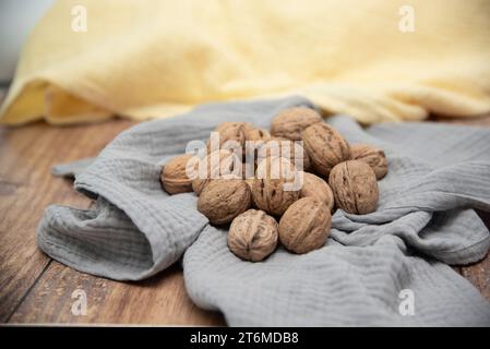 Food background. Walnut kernels close-up. Chopped nuts lie on a table. Stock Photo
