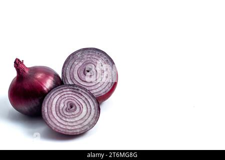 Red onion. Beautiful vegetables for a salad. Vegetables on a white background.  A red onion is a spherical-shaped vegetable covered with a thin, red s Stock Photo