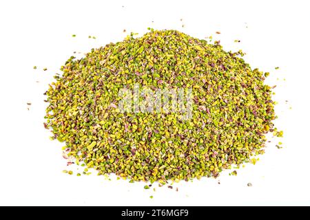 Chopped cut pistachio nuts Concept. Ground, Milled, Crushed or Granulated Pistachio Powder. Stock Photo