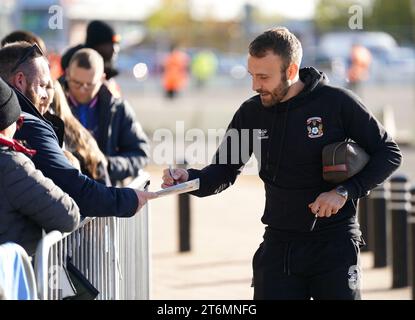 Coventry City's Liam Kelly signs autographs for fans ahead of the Sky Bet Championship match at the Coventry Building Society Arena, Coventry. Picture date: Saturday November 11, 2023. Stock Photo