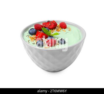 Tasty matcha smoothie bowl served with berries and oatmeal isolated on white. Healthy breakfast Stock Photo