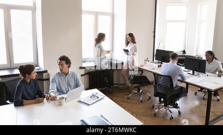 Multiethnic business team working in small office space Stock Photo